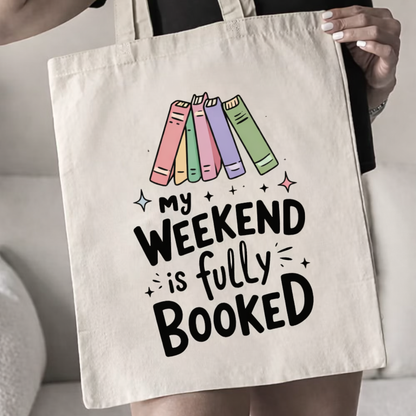 Tote bag with colorful books and 'My weekend is fully booked' text
