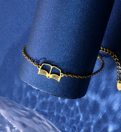 Gold bracelet with a unique design on a blue background